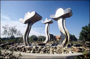 <i>Three Clouds Harvard Circle Fountain</i> adorns a traffic circle near Walbridge Park in South Toledo. The sculpture is one of dozens obtained with help from the One Percent for Art program.