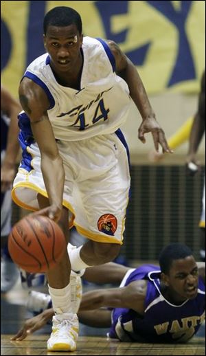 William Buford steals the ball from Waite's Dishon Harris and leaves him in the dust. Buford led Libbey with 19 points.