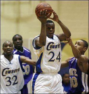 Tony Brown hauls in a rebound last night for Libbey, ranked No. 4 in the state in D-II. The Cowboys improved to 14-2 overall and 9-1 in the City League with a win over Waite.