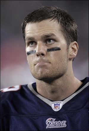 New England Patriots quarterback Tom Brady watches late in the fourth quarter of the Patriots' 17-14 loss to the New York Giants.