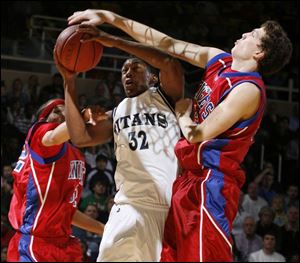 St. John's Tim Simmons tries to get by St. Francis' Storm Stanley last night at Savage Hall . Simmons scored nine points.