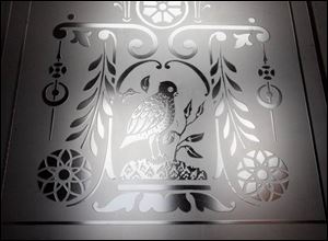 An etched window is one of the numerous historic details that have wowed some visitors and failed to impress others.
