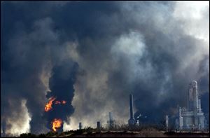 Thick smoke is seen after multiple explosions rocked an oil refinery in Big Spring, Texas, today.