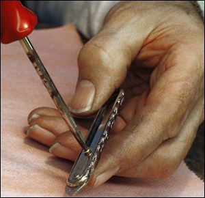 The knife Christy is assembling was designed by his grandfather at his family's business.
