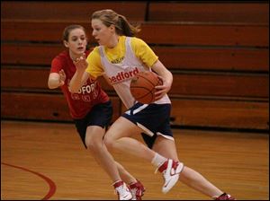 Kaylee Foster drives against Katie Bollin in practice. Foster, a junior, leads Bedford in scoring at 10 points per game. 