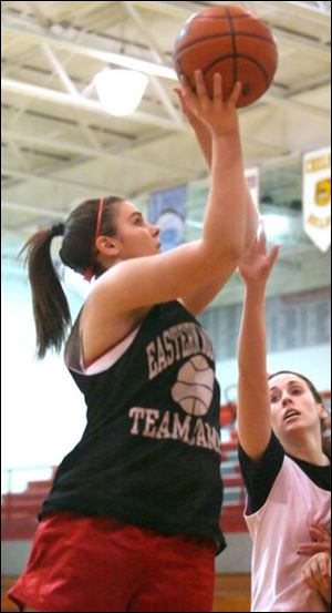 Jennifer Redmond, a senior, shoots in practice against Jackie Harrison. Bedford is 18-2 overall and won the Southeastern Conference Red Division for the second straight season. 