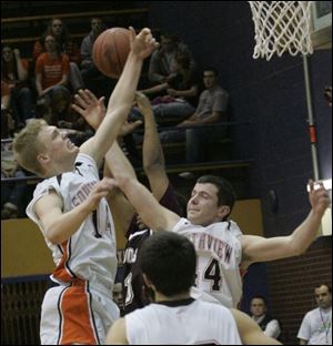 Southview's Andy Borcherdt, left, and Jordan Scott battle Scott's David Sweeney, back, for an offensive rebound last night.