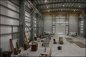 At 20,000 square feet, the fabrication shop is only half the size of the facility the port authority had planned.