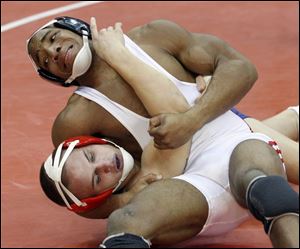 Bowling Green s Rudy Hendon has defending state champ Tony
James in trouble, but the Austintown Fitch wrestler won. (THE BLADE/ANDY MORRISON)
<br>
<img src=http://www.toledoblade.com/graphics/icons/photo.gif> <b><font color=red>VIEW</b></font color=red>: <a href=