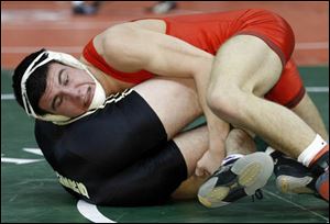 Kirk Tank of Oak Harbor scores the winning takedown against Hunter Pool of Bellefontaine Benjamin Logan during a Division II 152-pound semifinal. 
<img src=http://www.toledoblade.com/graphics/icons/photo.gif> <b><font color=red>VIEW</b></font color=red>: <a href=