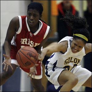 Central Catholic s Sharise Calhoun steals the ball from Solon s Skylar Cumberlander.