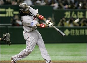 Boston Red Sox leftfielder Manny Ramirez his a two-run double off Oakland Athletics' Huston Street in the 10th inning of their Major League Baseball regular season opener at Tokyo Dome in Tokyo, Japan on Tuesday.