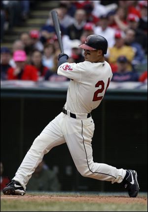 Cleveland outfielder Grady Sizemore follows through on his swing after connecting for a home run in the second inning.