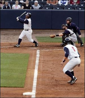 The Mud Hens' Timo Perez smacks a double, sending Dane Sardinha home from third base at Fifth Third Field. Toledo had lots of runners in last night's victory.