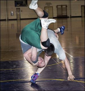 Adam Murray throws Matt Marek to the mat during a practice.