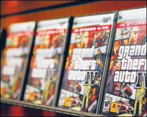 Grand Theft Auto IV video game
boxes are displayed on a rack.