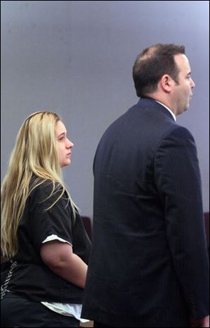 Police said Crystal Barnett told them her son threw Olivia into the nightstand, then said the baby fell and hit her head.