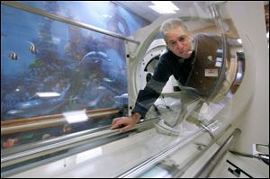 Mario Caruso, technical director of hyperbaric medicine for Comprehensive Healthcare Solutions Inc., checks out a hyperbaric chamber at the new Diabetes Care Center at St. Luke's. Mr. Caruso is serving as a consultant for the facility where patients with adult-onset diabetes can receive education and treatment. 