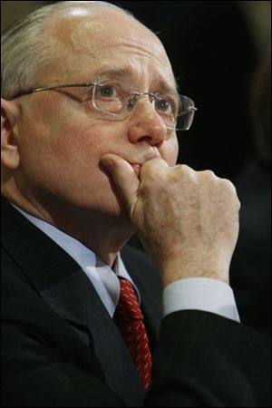 Veterans Affairs Secretary James Peake watches a television news clip on veterans' suicides ahead of his witness testimony before the House Committee on Veterans' Affairs regarding veterans' suicides on Capitol Hill in Washington, D.C., Tuesday.