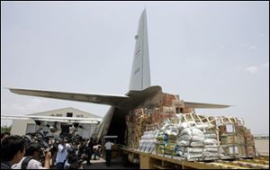 Supplies for victims of a devastating cyclone in Myanmar wait to be loaded on to a Thai military transport plane at the military airport in Bangkok, Thailand on Tuesday. Myanmar announced Tuesday it is delaying a crucial constitutional referendum in areas badly hit by a cyclone that killed more than 10,000 people and may have left as many as a million homeless. Officials feared the death toll could soar. 
