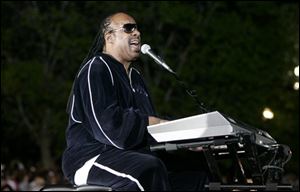 Singer Stevie Wonder performs before a rally for Democratic presidential hopeful, Sen. Barack Obama, D-Ill., in Indianapolis on Monday. (ASSOCIATED PRESS)
<br>
<img src=http://www.toledoblade.com/graphics/icons/video.gif> <b><font color=red>AP VIDEO</b></font color=red>: <a href=