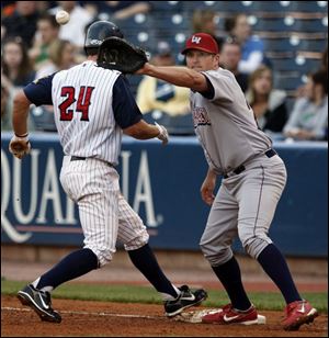 The Hens' Brent Clevlen beats a pickoff attempt as Lehigh Valley first baseman Andy Tracy waits for the throw. Tracy, who starred at Bowling Green High and BGSU, leads the team in homers with six.