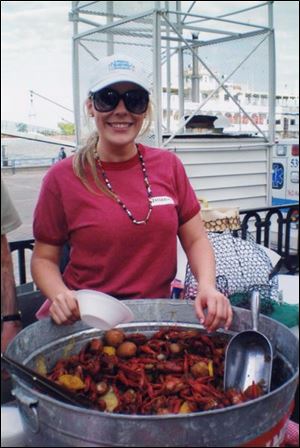 Bridgette Parker of Zatarain's dishes up a crawfish boil at a recent reception at the Riverwalk in New Orleans.