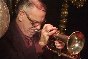 Jimmy Cook, who was celebrated for his taste and technique, plays his trumpet in a gig at Rusty's Jazz Cafe in 2001.