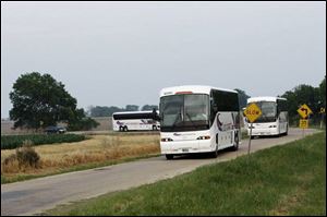 Buses transport wedding guests across the wide Texas scenery to the ranch of President Bush and his family in Crawford.