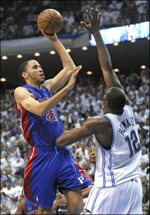 Tayshaun Prince shoots the game-winning shot over Dwight Howard.