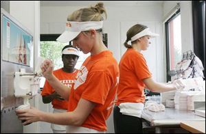 From left, Asia Evans, Alexa Sanders, and Tanya Hufford got jobs at Netty's on Monroe Street, where hiring has been cut.