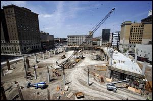 The Lucas County Arena will eventually soar 80 feet above ground level and seat 7,500 for Walleyes hockey games.
<br>
<img src=http://www.toledoblade.com/assets/gif/TO1599743.GIF> <b><font color=red>NEW</b></font color=red>: <a href=