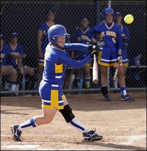 St. Ursula's Victoria Allen connects on a three-run triple against Notre Dame in the City League semifinals.
