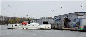 A commercial fishing boat prepares to dock and unload its catch from Lake Erie at the fishing port of Wheatley, Ont. (PHOTO BY TOM HENRY)
<br>
<img src=http://www.toledoblade.com/graphics/icons/forum.gif> <b><font color=red>TALK BACK</b></font color=red>: Join <a href=