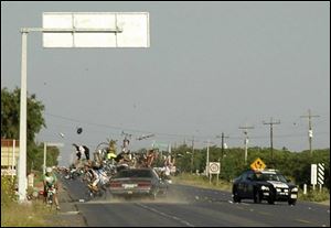 A car collides into cyclists participating in a race in Mexico's northern border city of Matamoros on Sunday. At least one person was killed and 14 injured when a driver slammed into a bicycle race. 