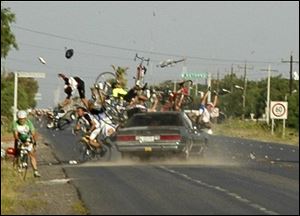 A car collides into cyclists participating in a race in Mexico's northern border city of Matamoros on Sunday. 