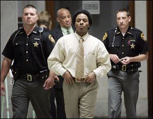 Stoney Thompson leaves the courtroom. He and his brother are charged in the Ohio Street slayings.