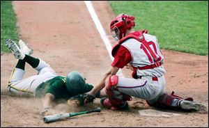 St. Francis catcher Luke Goblirsch tags out Clay runner Kyle Romstadt last night at Skeldon Stadium. The Knights avenged a 19-0 thumping by the Eagles just 13 days ago. (THE BLADE/LORI KING)
<br>
<img src=http://www.toledoblade.com/graphics/icons/video.gif> <b><font color=red>VIEW</b></font color=red>: <a href=