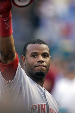 Ken Griffey Jr. homered off Florida lefty Mark Hendrickson in the first inning of the Reds' 9-4 victory against the Marlins.