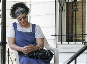 Denise Evans talks about her brother-in-law Sherman Smith at her Toledo home. Police found Smith propped against a pole with severe head injuries. Smith
