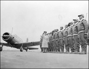 This Jan. 23, 1942 photograph provided by the U.S. Army Signal Corps shows Major James Ellison, left, inspecting the air cadets in training at Tuskegee Institute in Tuskegee, Ala.
