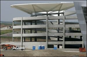 Indianapolis  five-story parking garage is being built more than 300 feet from the terminal to conform with federal law.

