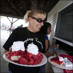 parade16p      6/16/2008        The Blade/Herral Long      need shots of  parade and strawbewrry fesival  give extras to neighbors   Andrea Whiting of aPerysburg   with strawberry shortcakes