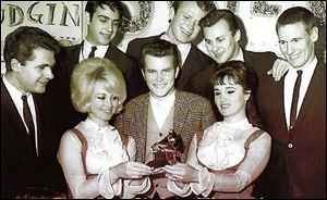 Randy Sparks, center, and the New Christy Minstrels celebrate
their Grammy for top album in 1962.