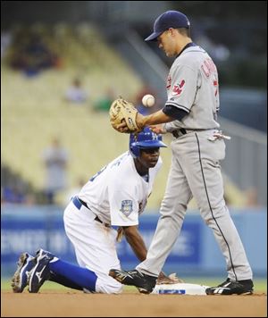 A frustrated Jamey Carroll walks away from the Dodgers  Juan
Pierre after he stole a base against the Indians last night.