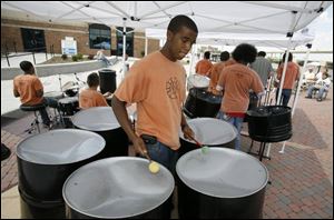 James Gerhart plays steel drums at the Great Lakes Riverfront Festival. The event continues today from 10 a.m. to 8 p.m.