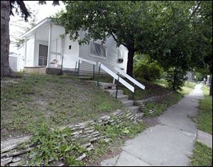 Tom s house, owned by a landlord who has declared bankruptcy.
