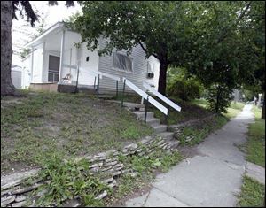 Tom s house, owned by a landlord who has declared bankruptcy.
