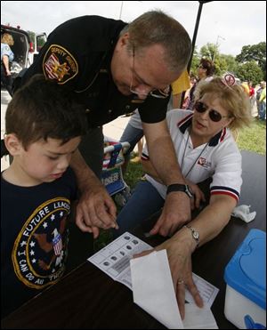 nbrw senior03p     6/28/2008        The Blade/Herral Long   Brent Smith 5  gets fingerprinted by deputy Bob Bevel  l Lynda Frass Frass stands by   all of toledo      The Eleanor Kahle Senior Center has planned its second annual  Community Day, which will feature appearances from Ronald McDonald,  Muddy, and Muddonna, and others. The Toledo Police and Fire Departmen  will participate as well. Please get some photos of the attractions.