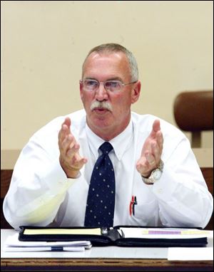 Wayne Colman discusses options for Scott High School during a meeting with Toledo school board members. Mr. Colman is planning manager for the Ohio School Facilities Commission, the state agency that provides funds for rebuilding local schools.